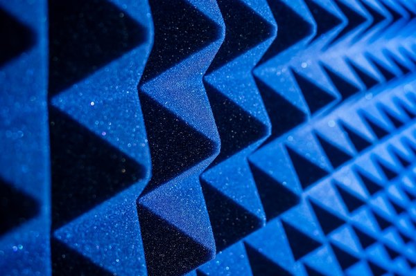 Which are the most effective sound-absorbing materials for DIY projects in busy UK urban apartments?